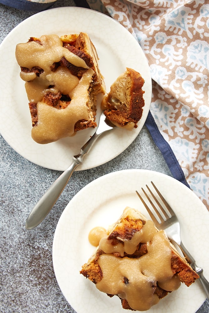 servings of Cookie Butter Pound Cake Bread Pudding on white plates