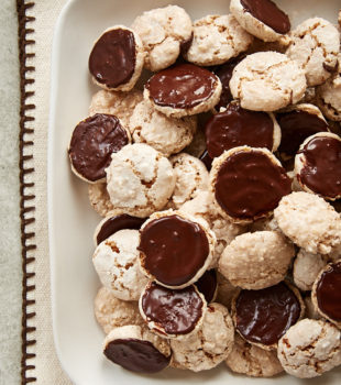 Hazelnut Macaroons piled on a white serving tray