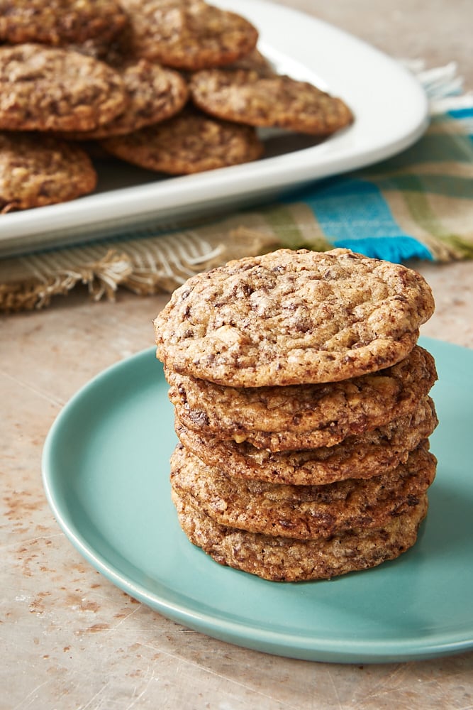 stack of chocolate chip cookies on a pale green plate