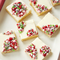 Peppermint Sugar Cookie Bars topped with holiday sprinkles