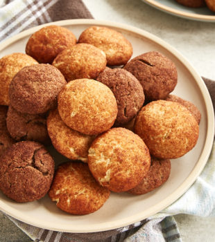 Snickerdoodles and Chocodoodles piled on a beige plate.