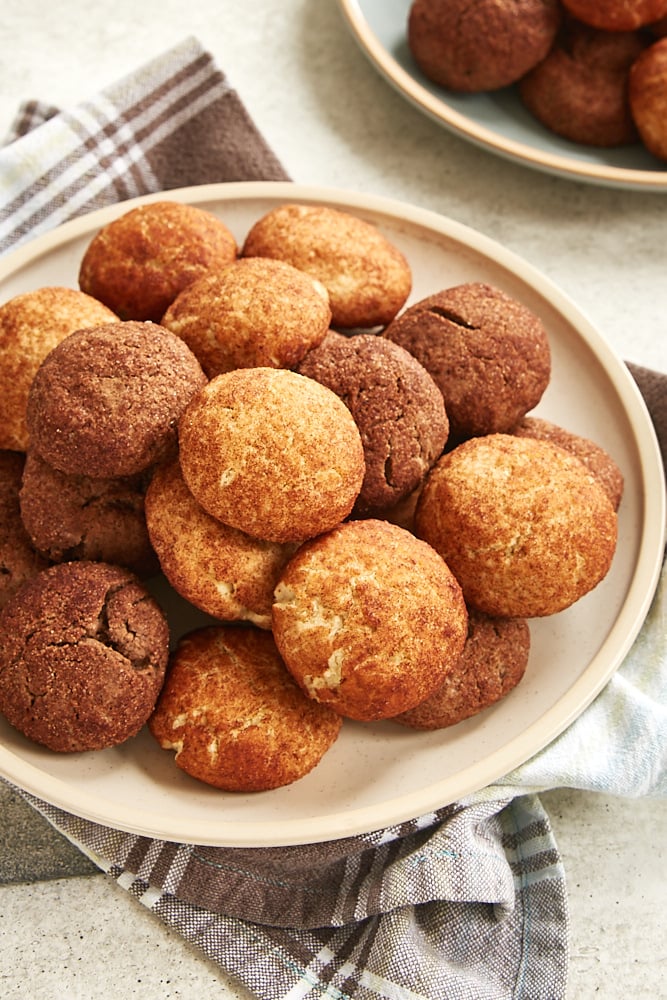 Snickerdoodles and Chocodoodles piled on a beige plate