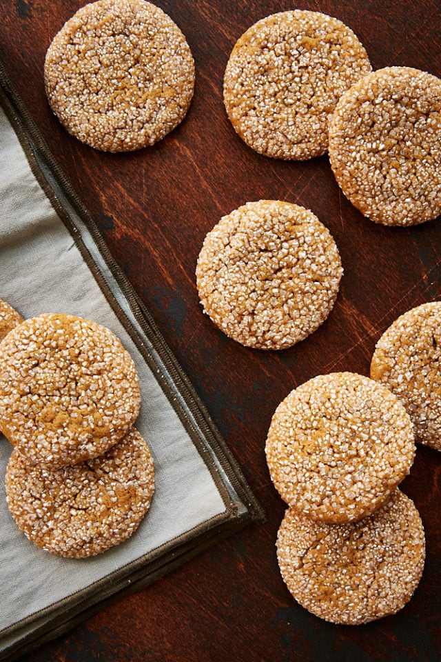 overhead view of Soft Ginger Molasses Cookies on a dark wooden surface