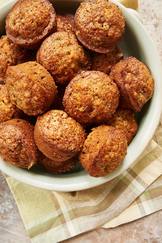 Cookie Butter Banana Muffins in a green stoneware dish