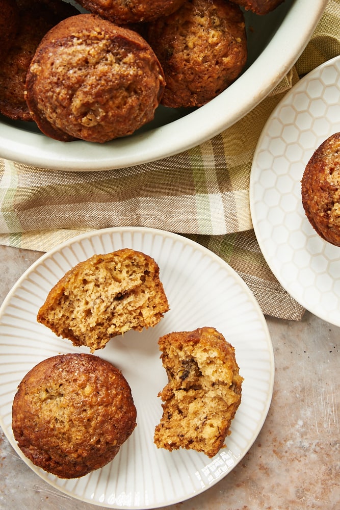 Cookie Butter Banana Muffins served on white and beige plates