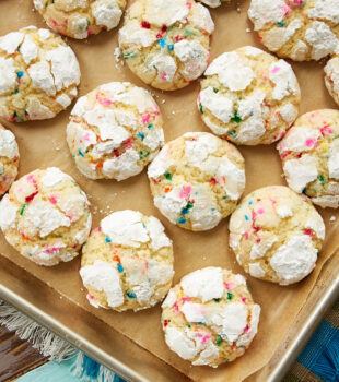Sprinkle Crinkle Cookies on a parchment-lined baking sheet
