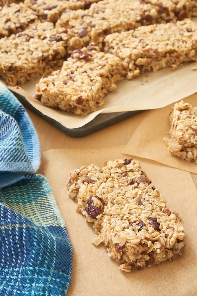 Cranberry Chocolate Chip Pecan Granola Bars on parchment paper