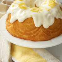 Lemon Bundt Cake on a white cake stand