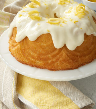 Lemon Bundt Cake on a white cake stand