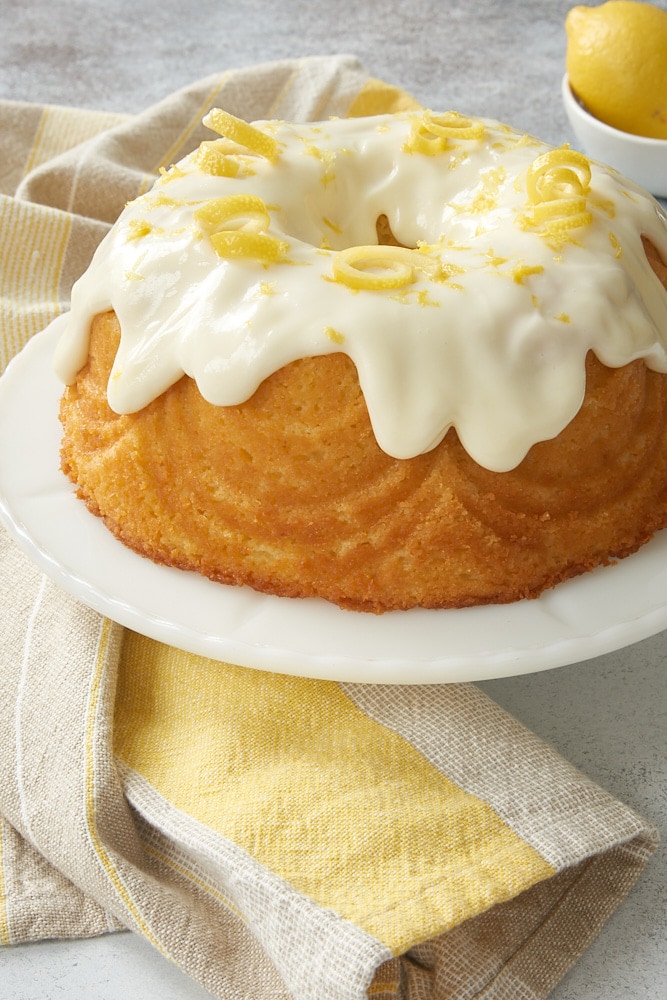 Lemon Bundt Cake on a white cake stand