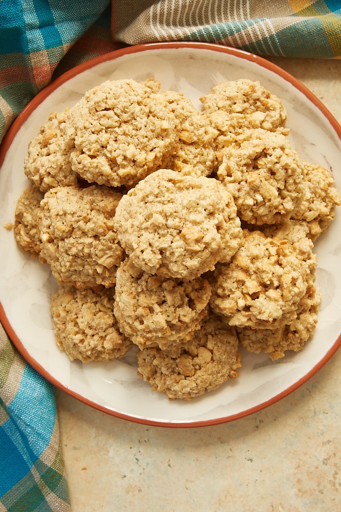 Salted Cashew Crunch Cookies served on an orange-rimmed plate