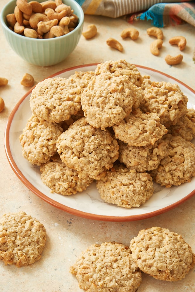 Salted Cashew Crunch Cookies on an orange-rimmed plate