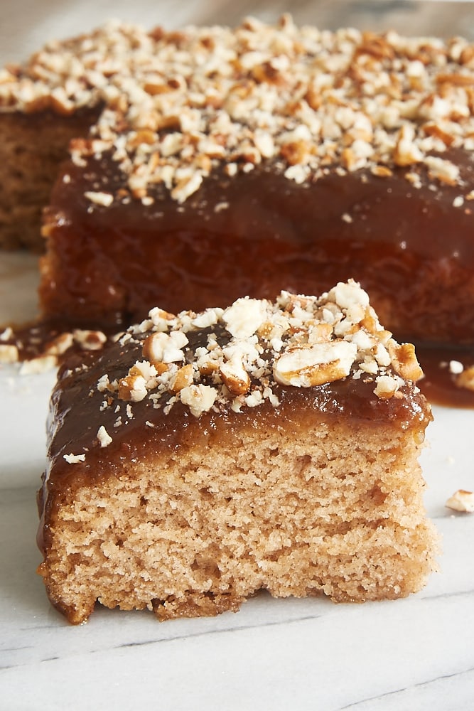 slice of Cinnamon Pudding Cake on a marble surface