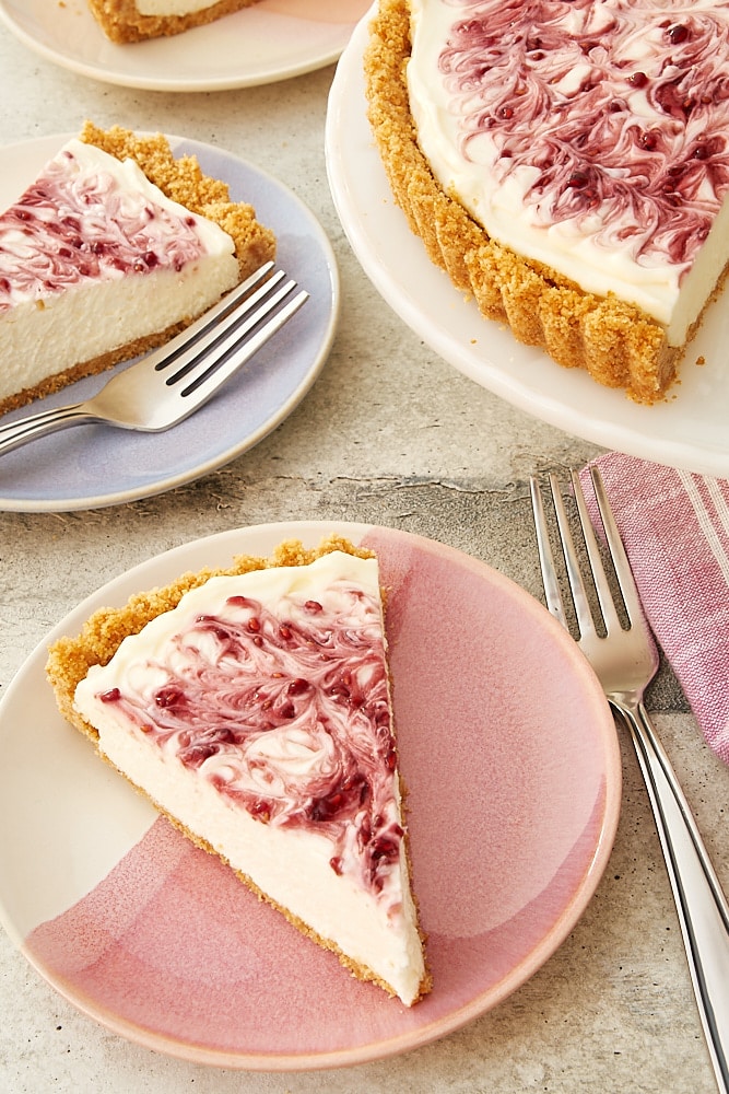 slice of No-Bake Raspberry Cheesecake on a pink and white plate