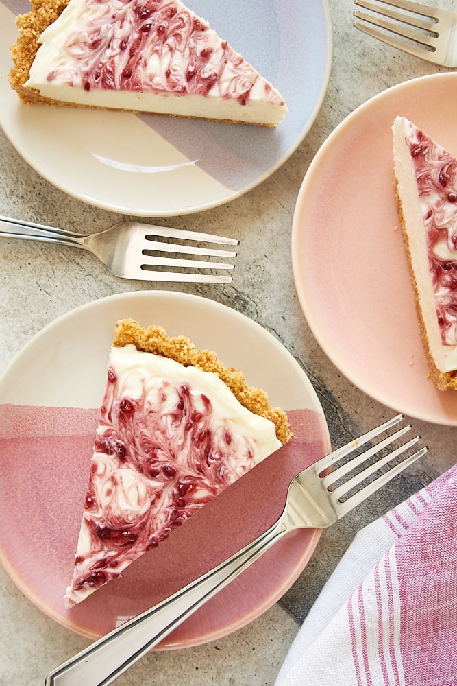 slices of No-Bake Raspberry Cheesecake on pastel plates