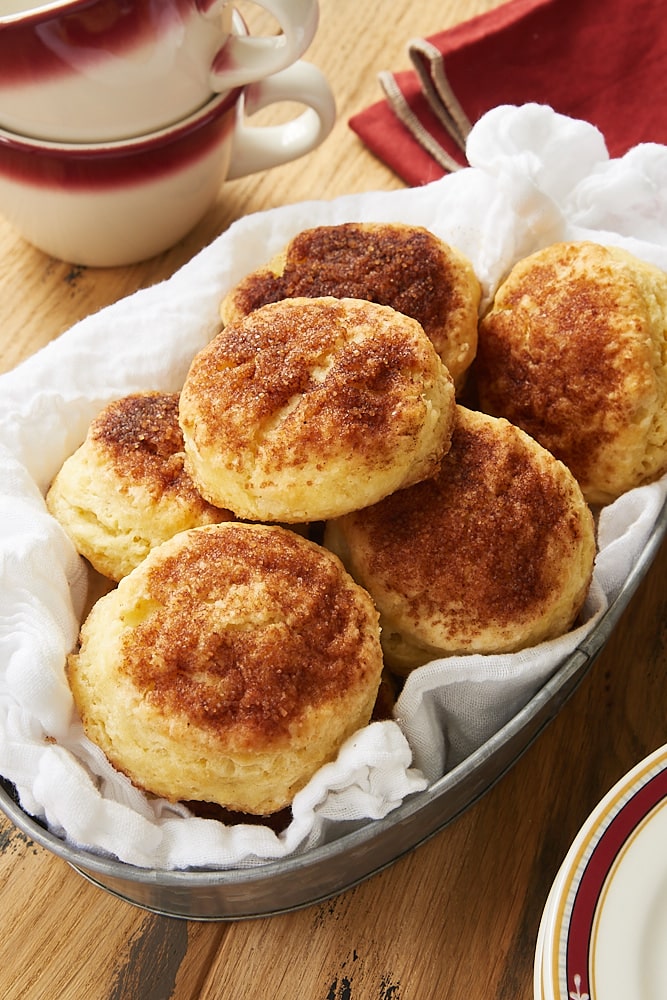 Cinnamon Sugar Biscuits in a metal basket lined with a white cloth