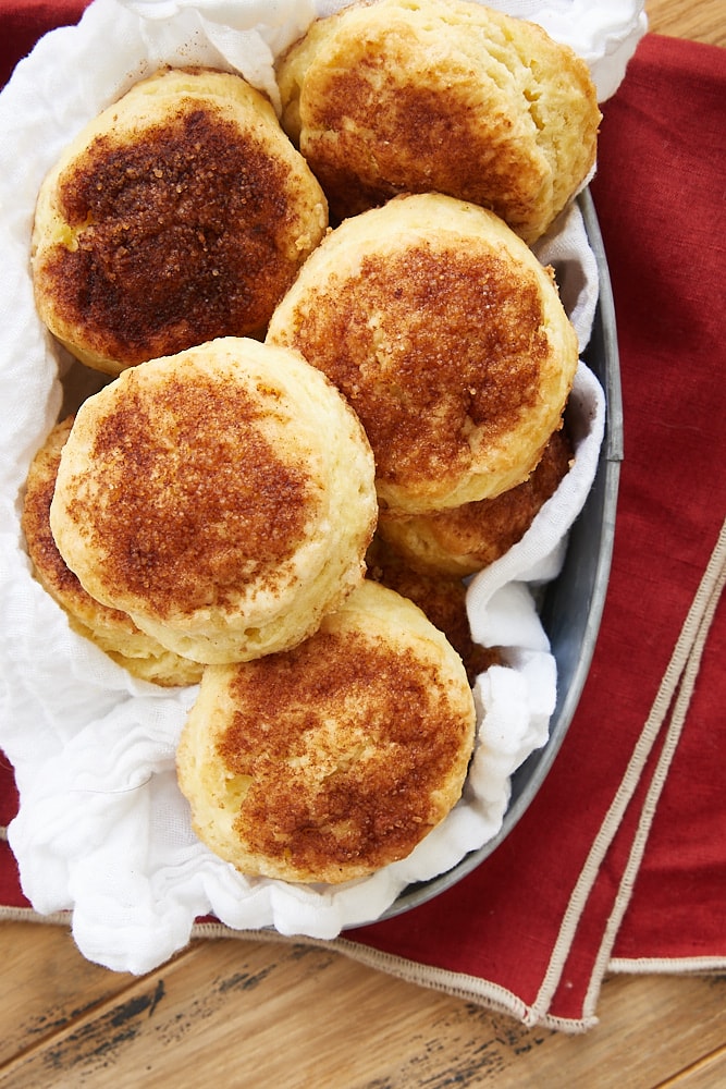 overhead view of Cinnamon Sugar Biscuits in a towel-lined basket