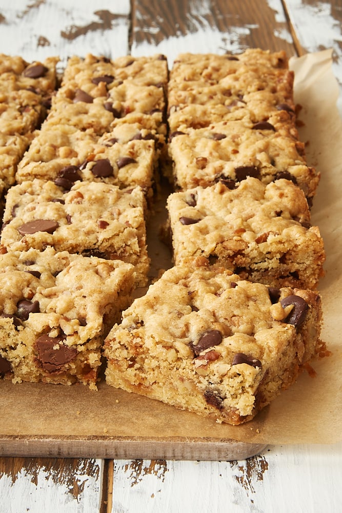 Loaded Chocolate Chip Cookie Bars on parchment paper