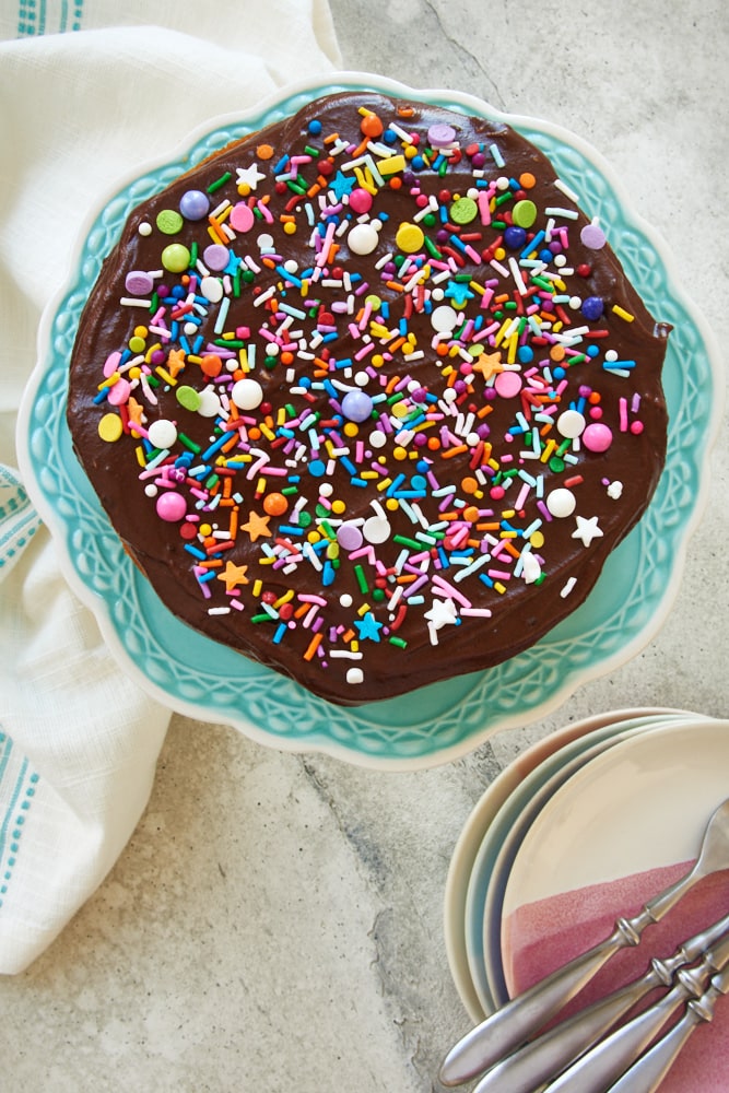 Overhead view of mini yellow cake with chocolate frosting