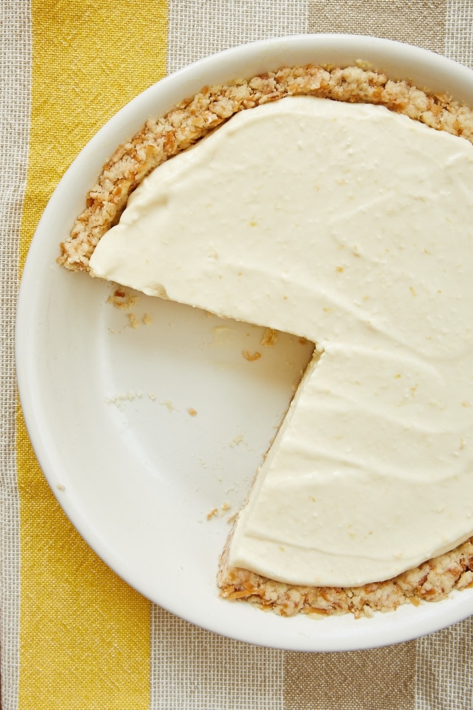 overhead view of Lemon Icebox Pie with Toasted Coconut Crust in a white pie plate