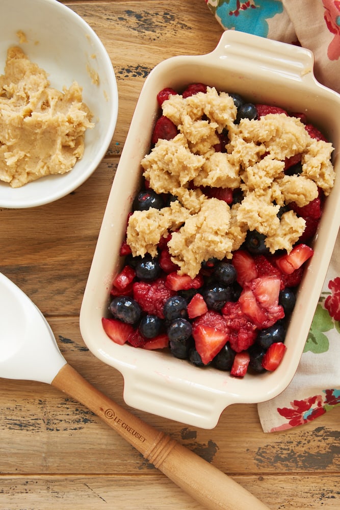 Mixed Berry Cream Cheese Crisp being assembled for baking