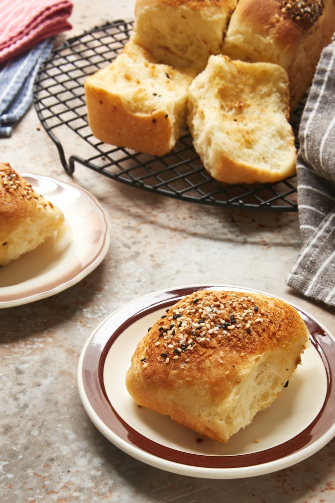 Pull-Apart Garlic Bread served on brown-rimmed white plates