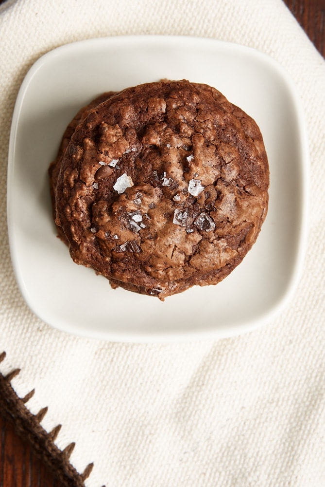 overhead view of Salted Chocolate Truffle Cookies stacked on a white plate