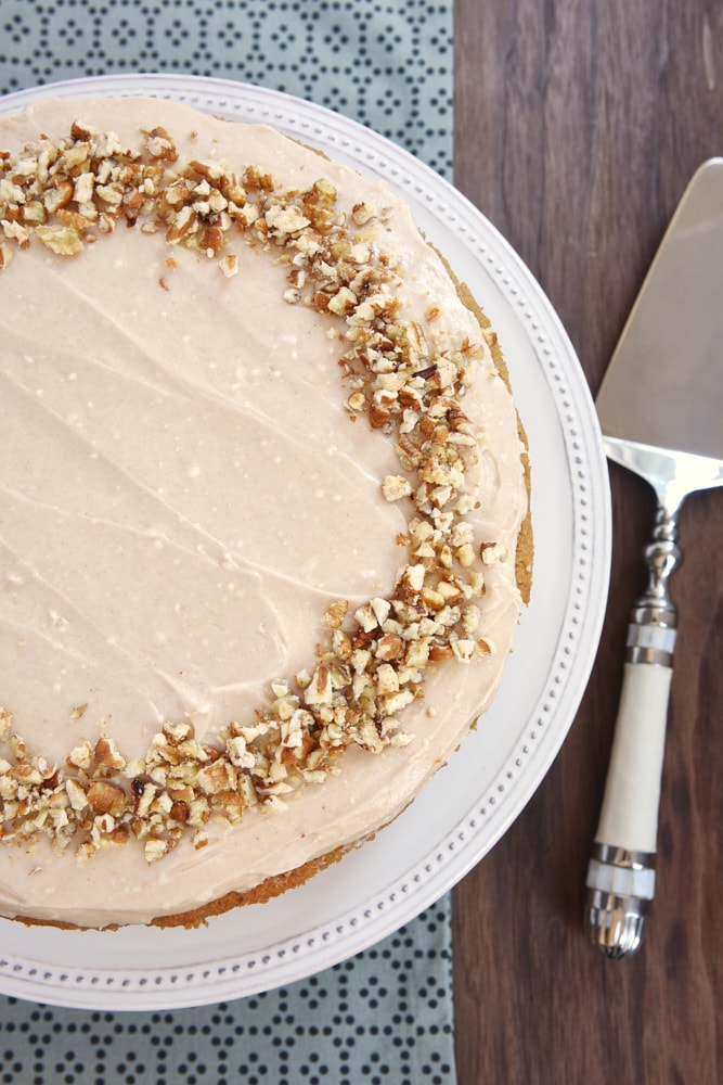 overhead view of Apple Spice Cake with Cinnamon Cream Cheese Frosting topped with chopped nuts