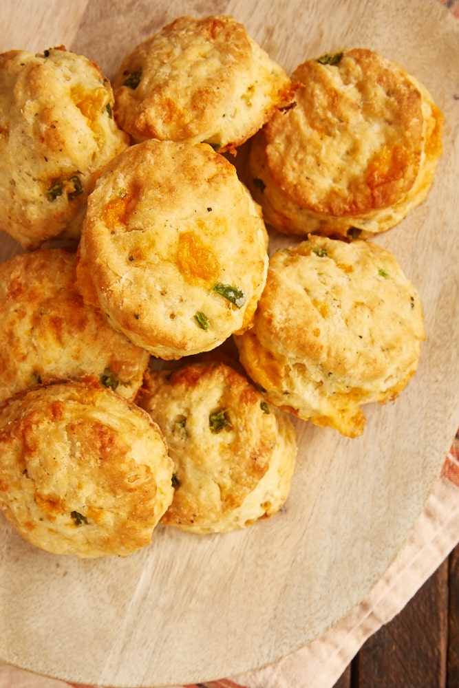 overhead view of Jalapeño Cheddar Biscuits on a wooden plate