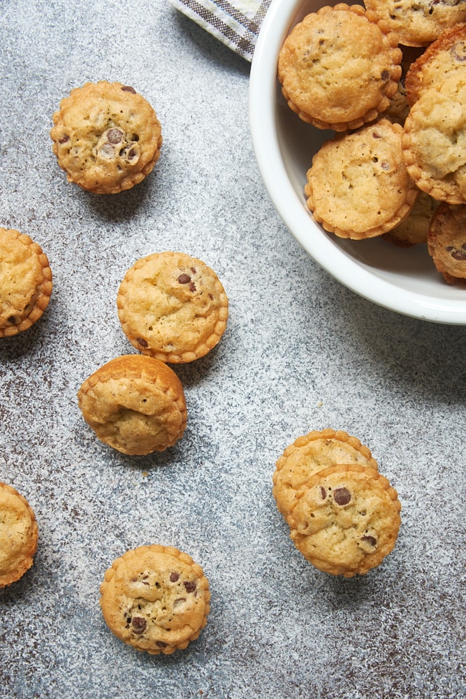 overhead view of Mini Chocolate Chip Pies on a gray surface