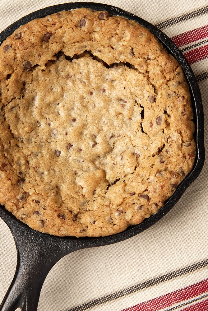 overhead view of a Mini Skillet Chocolate Chip Cookie on a striped towel