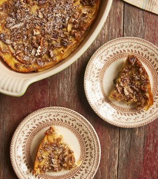 overhead view of Apple Bourbon Clafoutis served on brown-rimmed floral plates