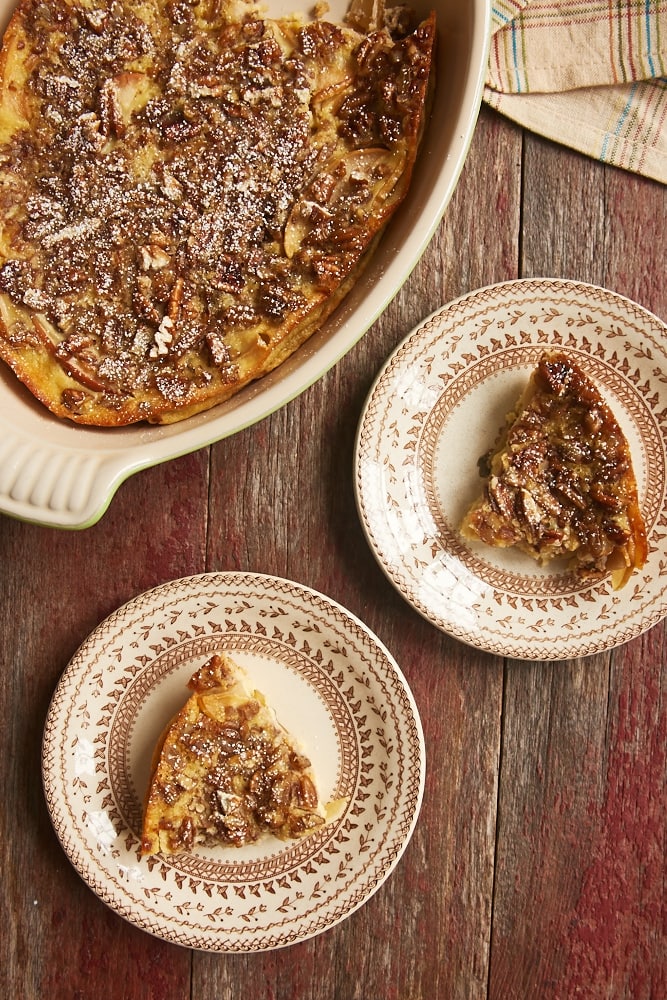 overhead view of Apple Bourbon Clafoutis served on brown-rimmed floral plates