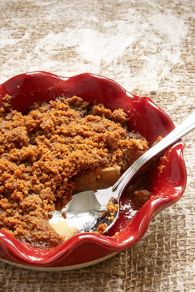 Apple Pear Biscoff Crisp with a spoonful missing