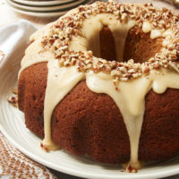 Brown Sugar Spice Cake with Caramel Rum Glaze on a white plate