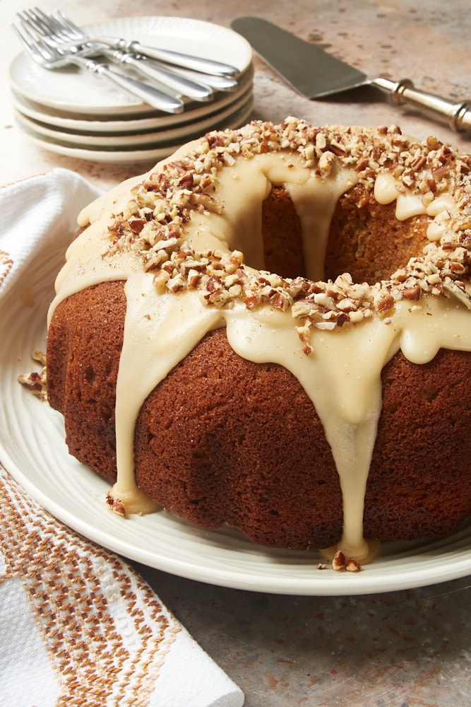 Brown Sugar Spice Cake with Caramel Rum Glaze on a white plate