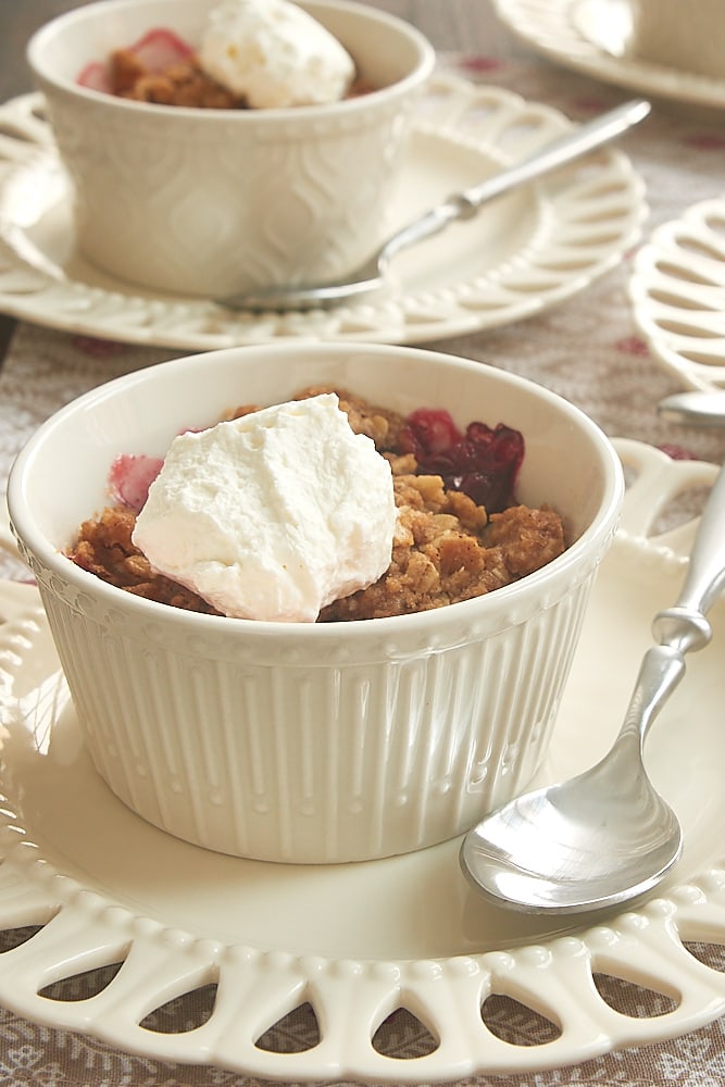 Cranberry Pear Crumbles served in white patterned ramekins