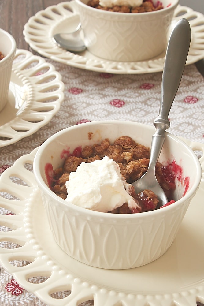 Cranberry Pear Crumbles topped with sweetened whipped cream