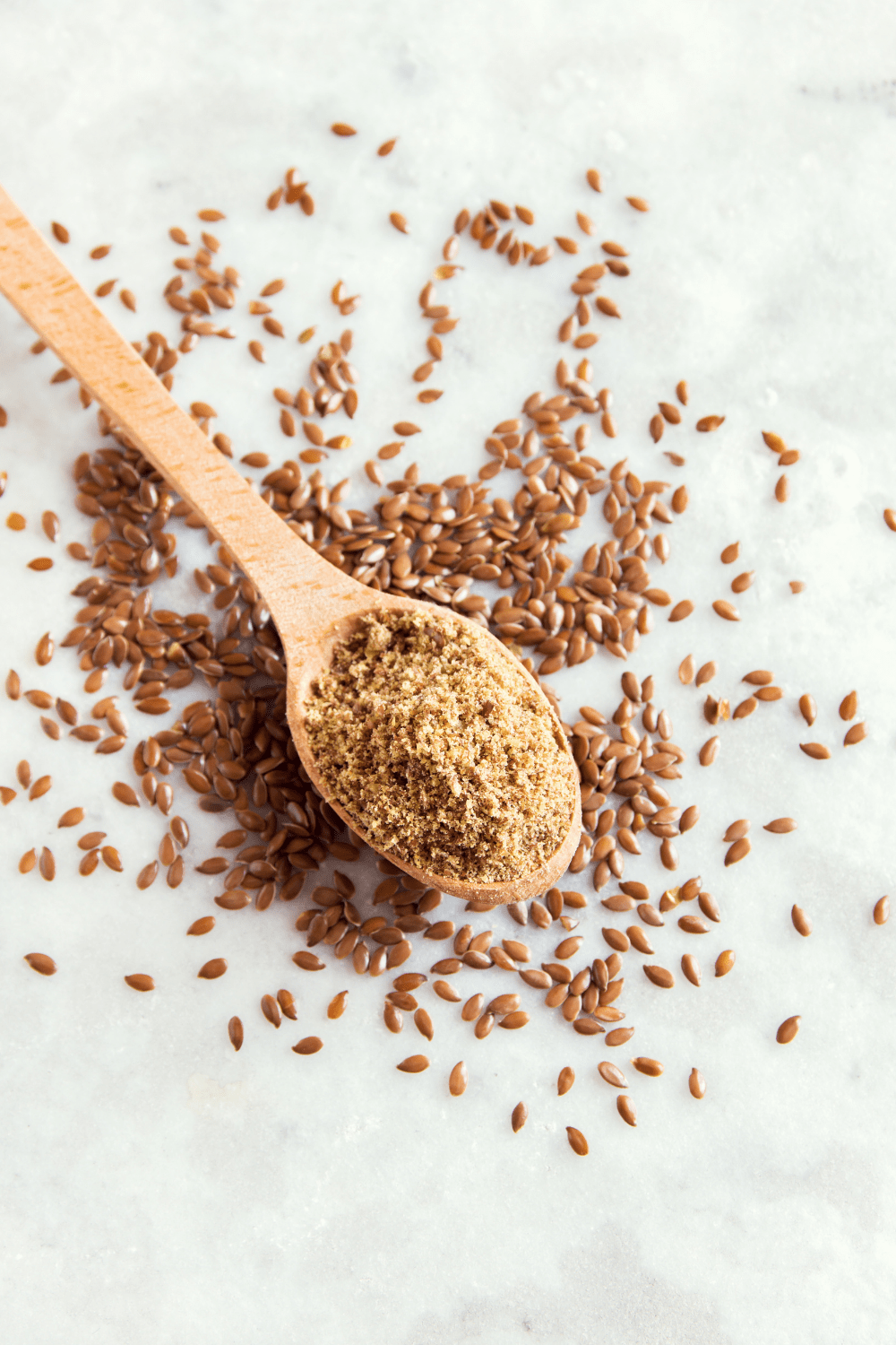 ground flax seeds in a wooden spoon