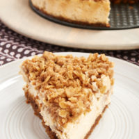 Pear Crisp Cheesecake on a pale gray plate