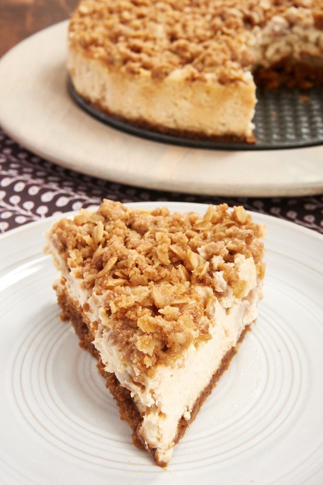 Pear Crisp Cheesecake on a pale gray plate