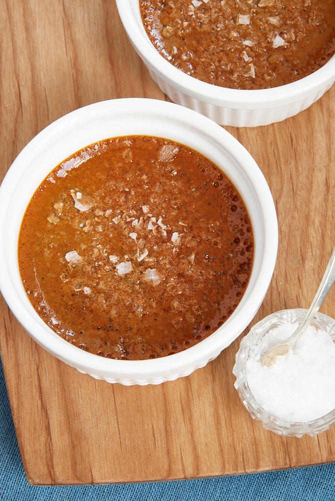 overhead view of Salted Caramel Pots de Creme on a wooden tray