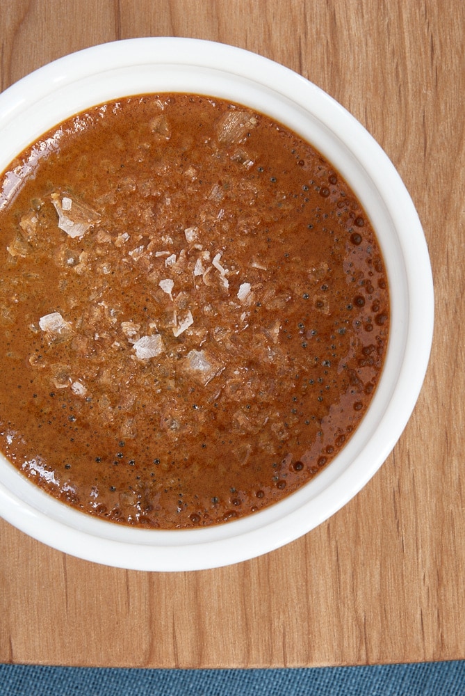 overhead view of Salted Caramel Pot de Creme on a wooden tray