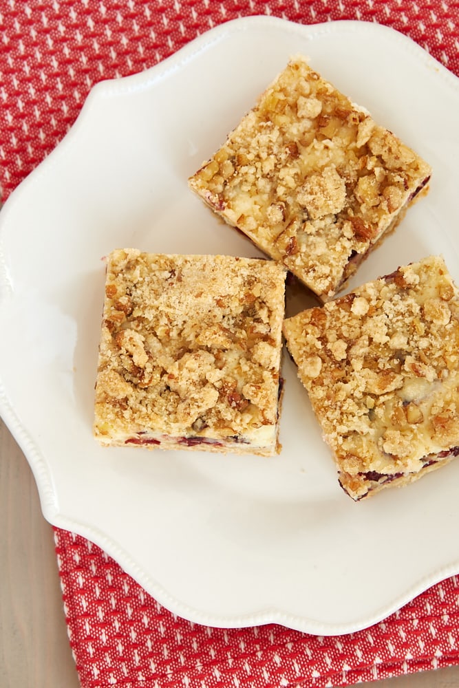 overhead view of Cranberry Crumble Cheesecake Bars on a white plate