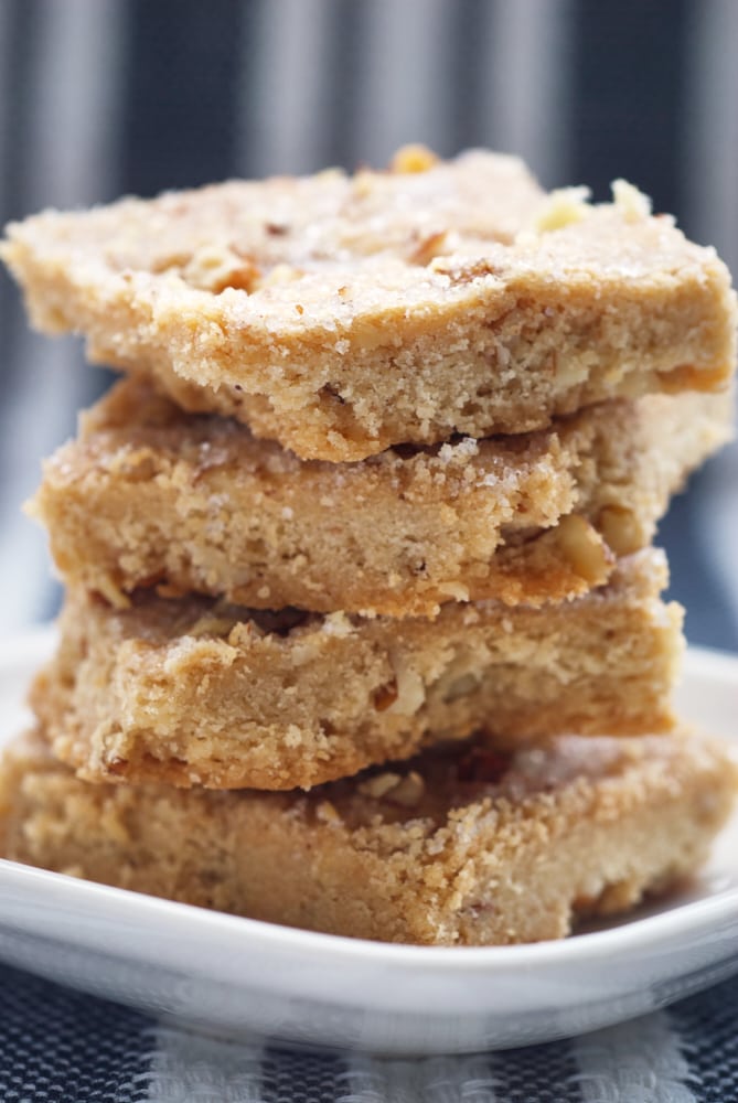 Stack of butter pecan shortbread on a white plate.