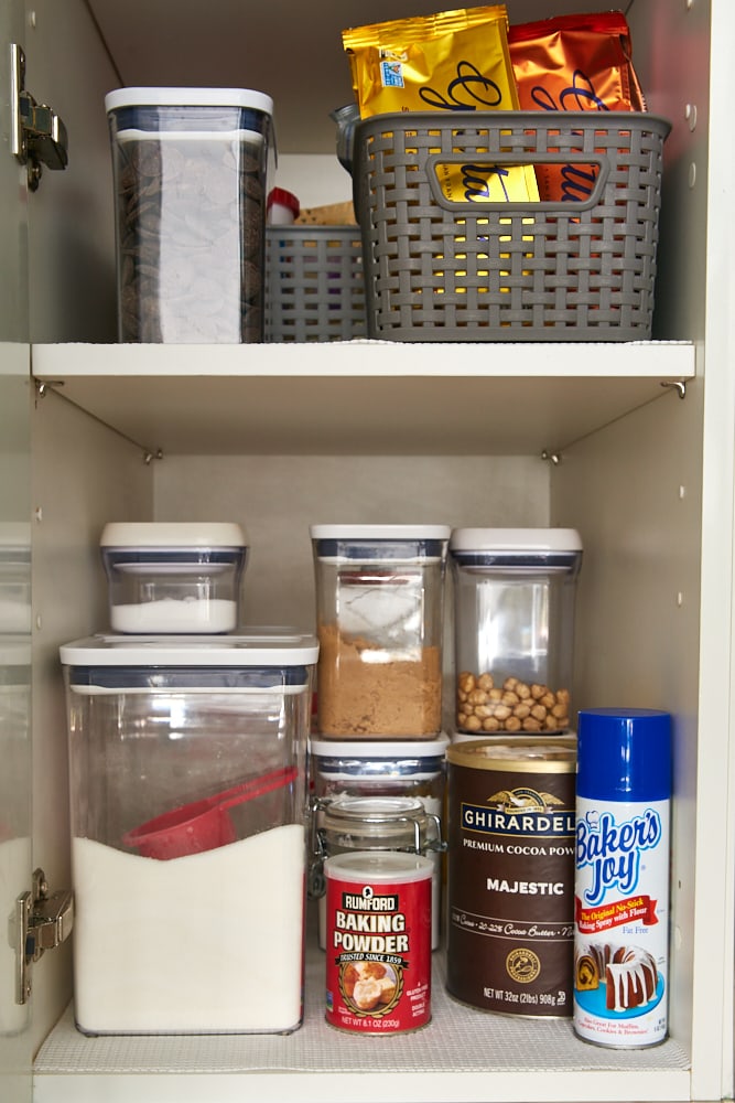 baking ingredients organized in a kitchen cabinet