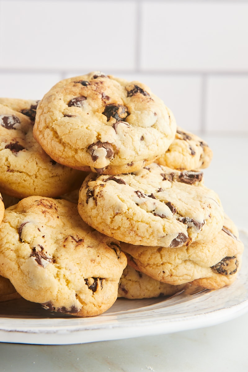 Plate of cookies with cherries and chocolate chips.