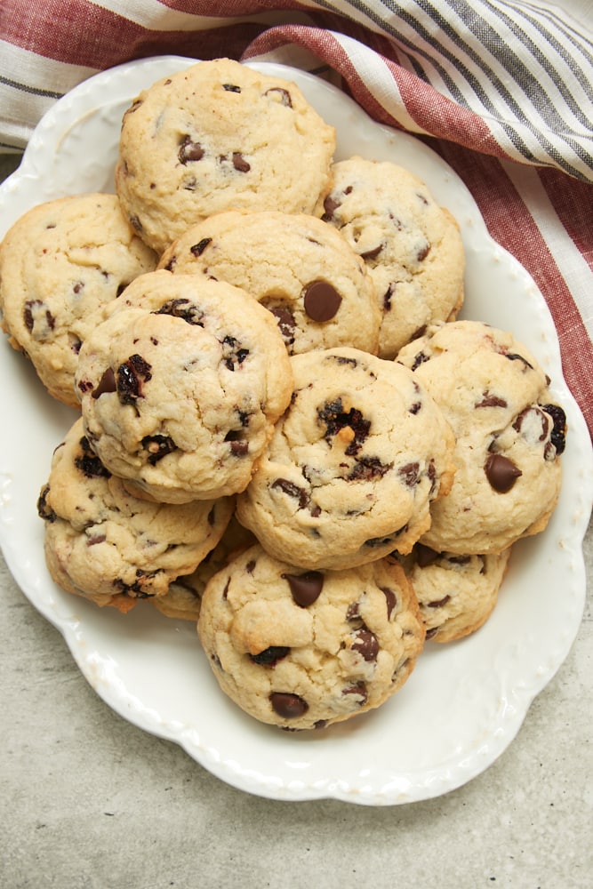overhead view of Cherry Chocolate Chip Cookies on an oval white plate