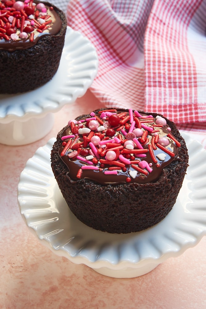 two Chocolate Cupcakes on small cake stands