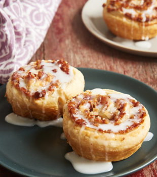 Berry Cream Cheese Pastry Swirls on a dark gray plate